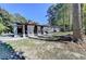 View of the back of the home with a large yard and an outdoor patio at 1824 Guardian Way, Lawrenceville, GA 30043