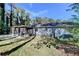 View of the back of the home with a large yard and screened-in back porch at 1824 Guardian Way, Lawrenceville, GA 30043