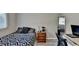 Comfortable bedroom with a workstation near the window and full-length mirror at 1824 Guardian Way, Lawrenceville, GA 30043
