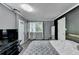 Well-lit bedroom with a large bed, neutral decor, and ample space for relaxation and rest at 1824 Guardian Way, Lawrenceville, GA 30043