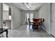 A dining room area featuring a ceiling fan and outdoor access through French doors at 1824 Guardian Way, Lawrenceville, GA 30043