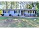 Inviting single-story home with a cozy front porch and well-manicured landscaping at 1824 Guardian Way, Lawrenceville, GA 30043