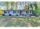 Charming one-story home with a well-maintained lawn and mature trees at 1824 Guardian Way, Lawrenceville, GA 30043