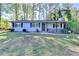 Lovely one-level home with neat landscaping and a cozy, covered entrance at 1824 Guardian Way, Lawrenceville, GA 30043