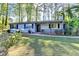 Lovely home with a freshly landscaped yard, neat curb appeal, and inviting porch for outdoor enjoyment at 1824 Guardian Way, Lawrenceville, GA 30043