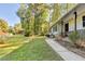 Spacious yard with a walkway leading to a home with a covered front porch at 1824 Guardian Way, Lawrenceville, GA 30043