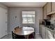 Eat-in kitchen featuring modern appliances, granite countertops and tile flooring at 1824 Guardian Way, Lawrenceville, GA 30043