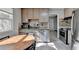 Bright kitchen with stainless steel appliances, tile floors, and a cozy breakfast nook at 1824 Guardian Way, Lawrenceville, GA 30043