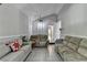 Bright living room featuring tile flooring, comfortable couches and neutral paint colors at 1824 Guardian Way, Lawrenceville, GA 30043