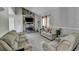 Bright living room with stone fireplace, tile floors, and comfortable seating at 1824 Guardian Way, Lawrenceville, GA 30043