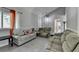 Bright living room featuring tile flooring, comfortable couches and neutral paint colors at 1824 Guardian Way, Lawrenceville, GA 30043