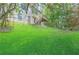 Spacious backyard featuring a deck and staircase on a lush green lawn at 2869 Hickory Run Cir, Duluth, GA 30096