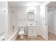 Clean, all-white bathroom with a shower-tub combo and neutral floors at 2869 Hickory Run Cir, Duluth, GA 30096