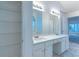 Bright bathroom with a double sink vanity and large mirror offers a spa-like retreat at 2869 Hickory Run Cir, Duluth, GA 30096
