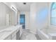 Bright bathroom with a large tub, and double sink vanity offers a spa-like retreat at 2869 Hickory Run Cir, Duluth, GA 30096