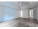 A spacious bedroom with a tray ceiling, neutral walls, and wood flooring offers a bright, airy feel at 2869 Hickory Run Cir, Duluth, GA 30096