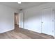 A simply decorated bedroom with neutral walls and wood-look flooring at 2869 Hickory Run Cir, Duluth, GA 30096