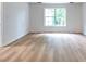 Large bright bedroom with wood-look floors and natural light at 2869 Hickory Run Cir, Duluth, GA 30096