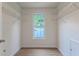 This walk-in closet features a window and white wire shelving for optimal storage and organization at 2869 Hickory Run Cir, Duluth, GA 30096