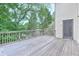 A spacious deck overlooking the trees offers a great place for entertaining at 2869 Hickory Run Cir, Duluth, GA 30096