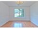 Dining room featuring hardwood floors, crown molding, and a large window at 2869 Hickory Run Cir, Duluth, GA 30096