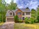 Charming two-story home with a brick facade, well-maintained landscaping, and a two-car garage at 2869 Hickory Run Cir, Duluth, GA 30096