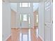 Bright foyer with hardwood floors, high ceilings, and a decorative glass front door at 2869 Hickory Run Cir, Duluth, GA 30096