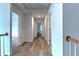 Bright hallway features wood-look floors and access to multiple rooms at 2869 Hickory Run Cir, Duluth, GA 30096