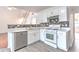 Well-lit kitchen with stainless steel appliances and access to living areas at 2869 Hickory Run Cir, Duluth, GA 30096