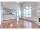 Bright living room featuring hardwood floors, a fireplace, and ample natural light at 2869 Hickory Run Cir, Duluth, GA 30096