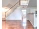 Light-filled living room showcases hardwood floors and staircase to the second level at 2869 Hickory Run Cir, Duluth, GA 30096
