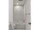 Bright bathroom featuring a tile surround tub and shower and modern fixtures at 3794 Ashford Lake Ne Ct, Brookhaven, GA 30319