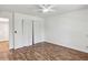 Bedroom featuring laminate floors and large closet at 3794 Ashford Lake Ne Ct, Brookhaven, GA 30319