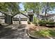 Charming exterior of home featuring an attached two car garage and a welcoming entrance at 3794 Ashford Lake Ne Ct, Brookhaven, GA 30319