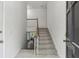 Bright foyer with staircase and a glimpse of the living area, creating a welcoming first impression at 3794 Ashford Lake Ne Ct, Brookhaven, GA 30319