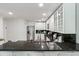 A well lit kitchen with granite counters and stainless steel appliances at 3794 Ashford Lake Ne Ct, Brookhaven, GA 30319