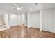 Spacious living room with hardwood flooring, ceiling fan, and neutral paint at 3794 Ashford Lake Ne Ct, Brookhaven, GA 30319
