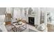 Bright living room featuring a fireplace, neutral furniture and decor, and hardwood floors at 3794 Ashford Lake Ne Ct, Brookhaven, GA 30319
