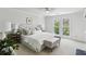 Inviting main bedroom with bright windows, soft carpet, ceiling fan, and neutral decor at 3794 Ashford Lake Ne Ct, Brookhaven, GA 30319