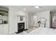 Another view of the main bedroom fireplace, and a view to the laundry area at 3794 Ashford Lake Ne Ct, Brookhaven, GA 30319