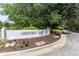 Ashford Lake entrance sign with manicured landscaping, showcasing community pride at 3794 Ashford Lake Ne Ct, Brookhaven, GA 30319