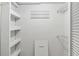 Walk-in closet with adjustable shelving for optimal storage and organization at 3794 Ashford Lake Ne Ct, Brookhaven, GA 30319