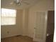 Bright bedroom with carpet, a ceiling fan, and natural light from a large window at 412 Hawkstone Way, Alpharetta, GA 30022