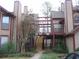 Condominium featuring wooden stairs, beams and attractive landscaping with low growing shrubs at 412 Hawkstone Way, Alpharetta, GA 30022