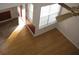 Bright living room with hardwood floors and a ceiling fan at 412 Hawkstone Way, Alpharetta, GA 30022