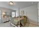 Charming bedroom with a four-poster bed, soft carpet, and plenty of natural light at 4215 Cordova Ln, Cumming, GA 30028