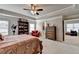Primary bedroom featuring a plush carpet, large windows, and a beautiful reading nook at 4215 Cordova Ln, Cumming, GA 30028