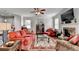 Inviting living room with a stone fireplace, plush seating, and ample natural light at 4215 Cordova Ln, Cumming, GA 30028
