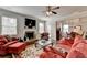 Cozy living room with a stone fireplace, large windows, and comfortable seating at 4215 Cordova Ln, Cumming, GA 30028