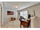 Spacious office featuring neutral walls, plush carpet, and a large window allowing for lots of light at 4215 Cordova Ln, Cumming, GA 30028